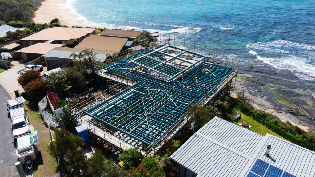 Drone view of Bombora coastal home under construction by Sureline Building Group, Shoalhaven NSW.